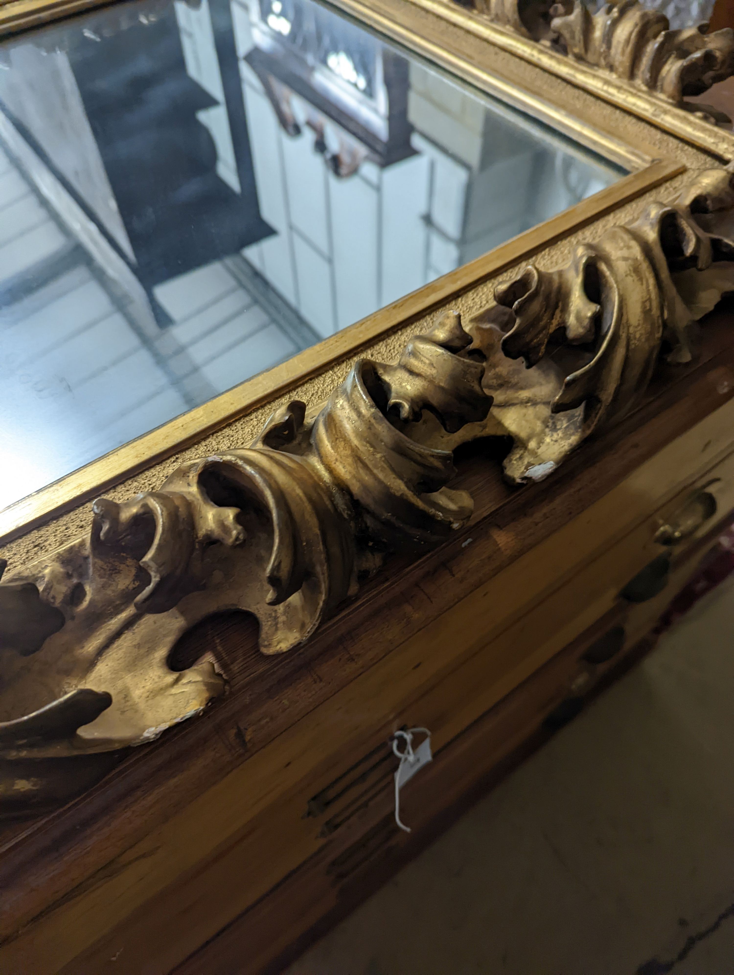 A large 19th century rectangular carved giltwood wall mirror with acanthus scroll frame, width 76cm, height 94cm